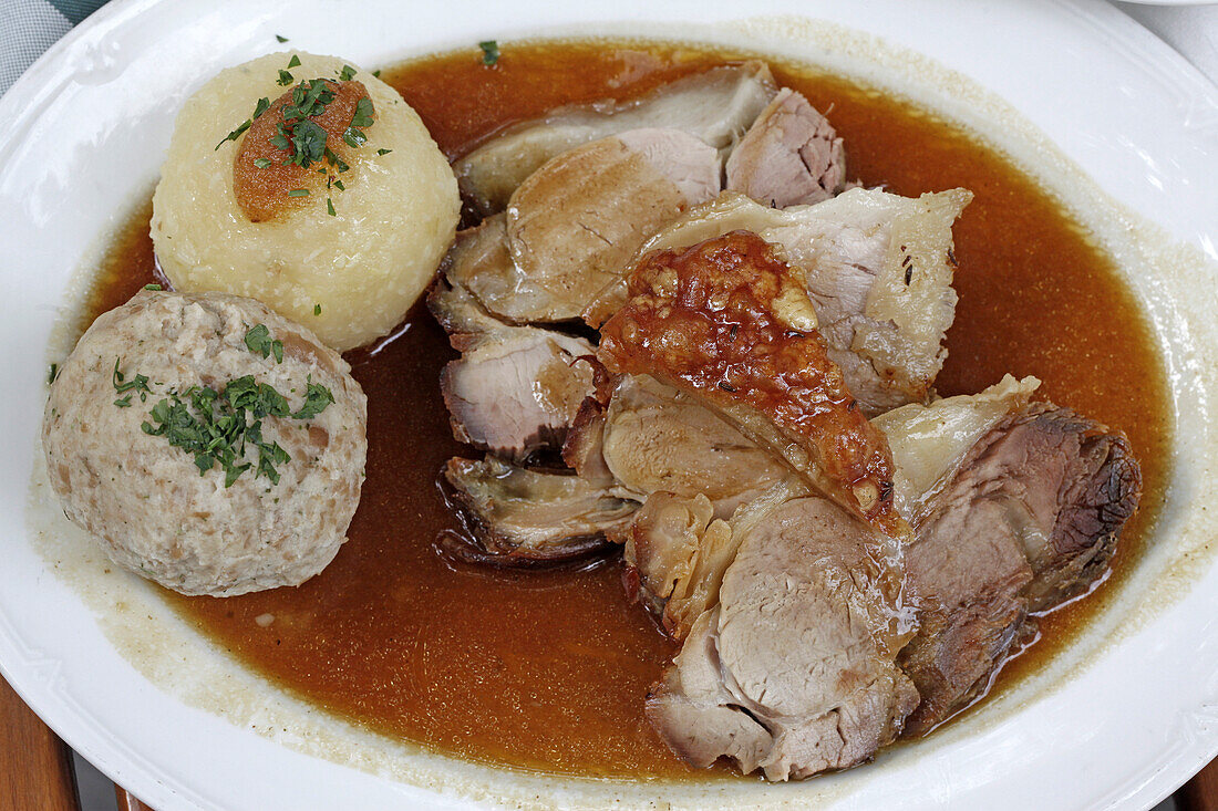 Bavarian pork roast and two different kinds of dumplings, Bratwurstgloeckl, Frauenplatz, Munich, Upper Bavaria, Bavaria, Germany