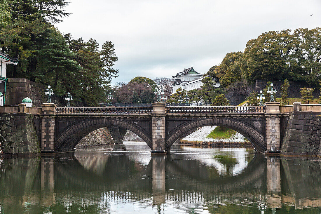 Nijubashi Bridge and Fushimi-Yagura Tower with snow at garden of Imperial Palace, Chiyoda-ku, Tokyo, Japan