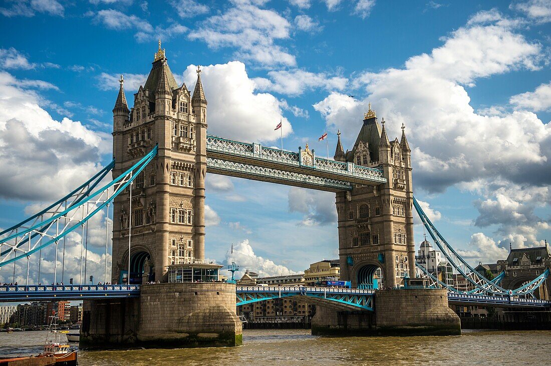 Boats passing by the Tower Bridge on the River Thames in London, England.