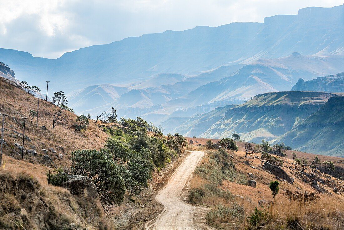Empty dirt road winding through Sani Pass, between South Africa and Lesotho.
