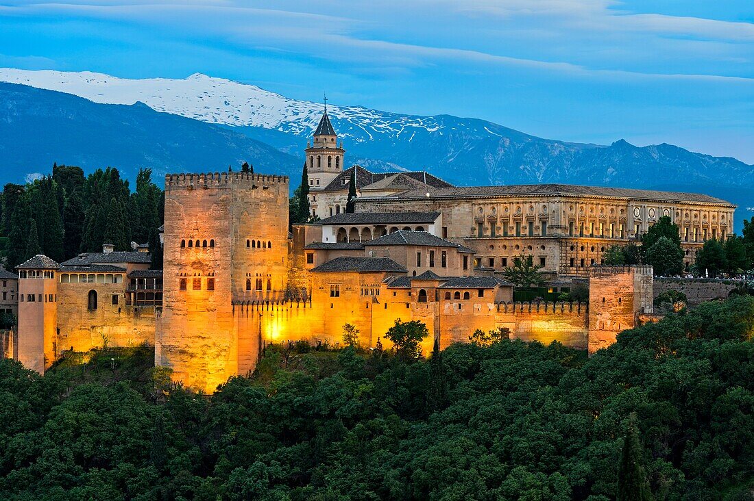 Evening light at the Alhambra, UNESCO World Heritage Site, against the Sierra Nevada mountain range, Granada, Andalusia, Spain.