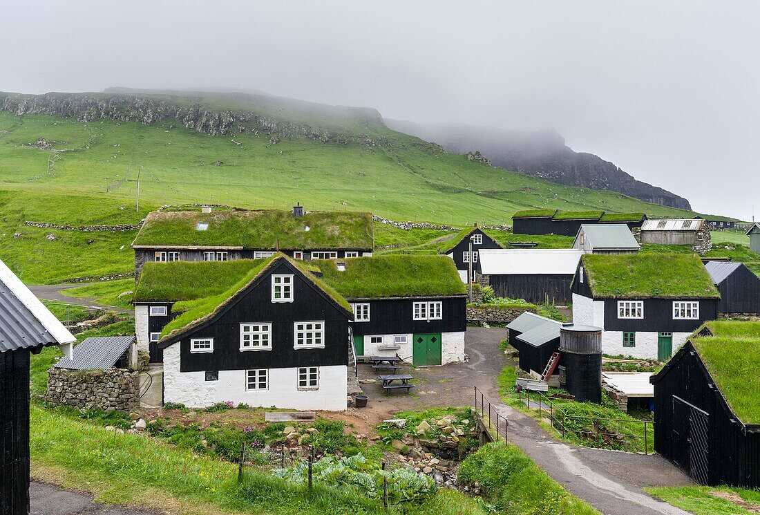 The village on the island Mykines, part of the Faroe Islands in the North Atlantic. Europe, Northern Europe, Denmark, Faroe Islands.