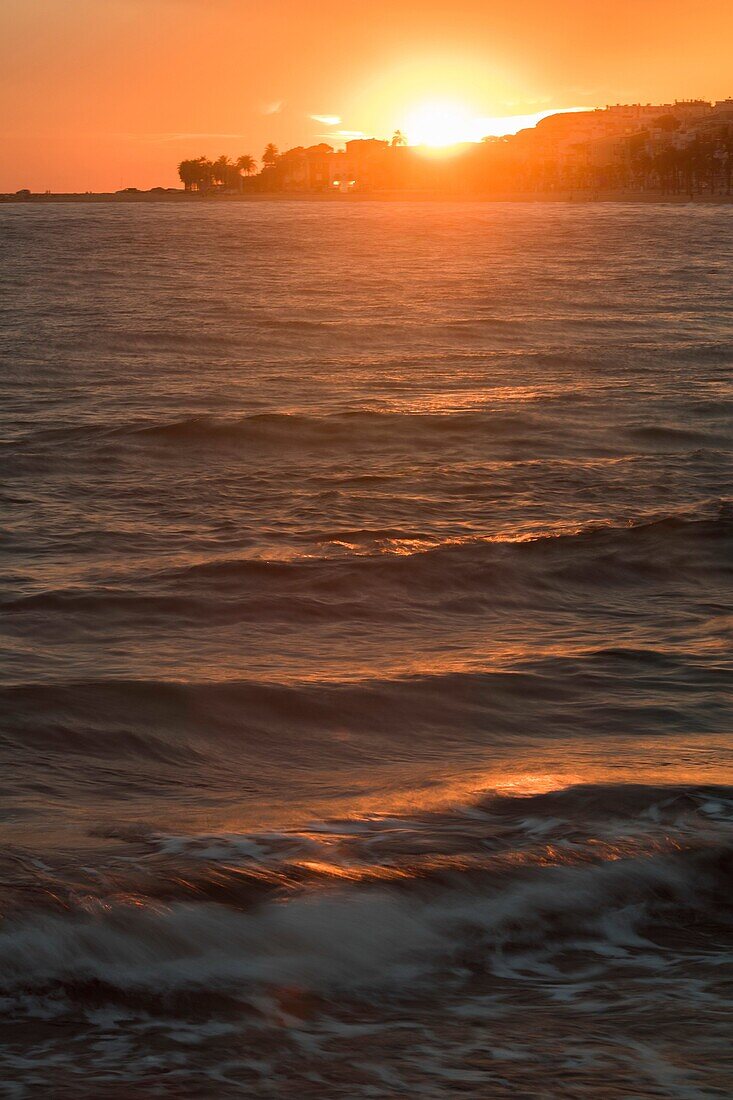 Sunset sea in Villajoyosa Mediterranean sea in background Alicante Spain.