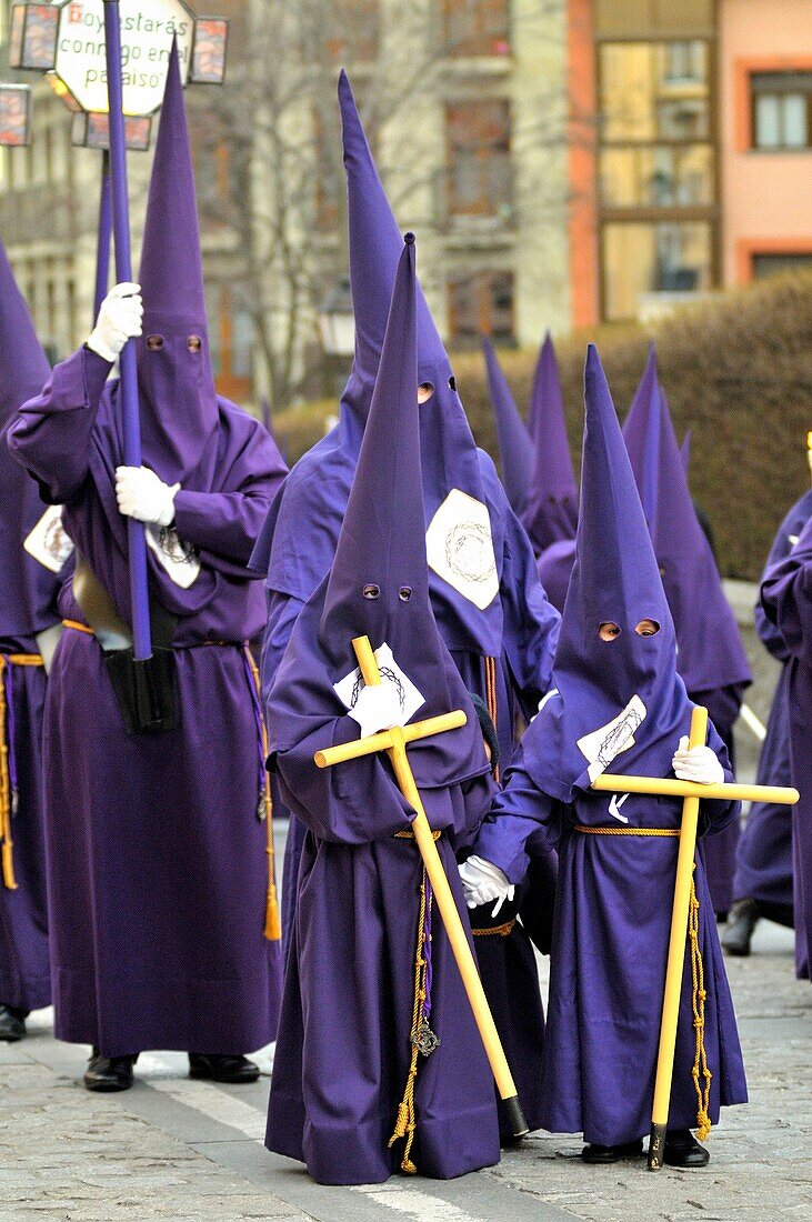 Capuchins children with cross in the Good Friday procession of San Lorenzo de El Escorial (Madrid), Spain.