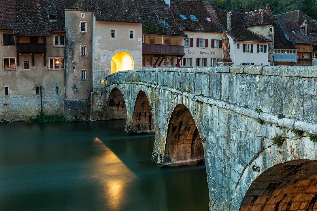 Night falls in St-Ursanne, canton Jura, Switzerland.