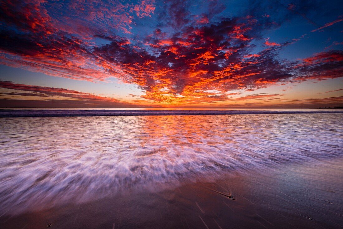 Sunset over the Channel Islands from Ventura State Beach, Ventura, California USA.