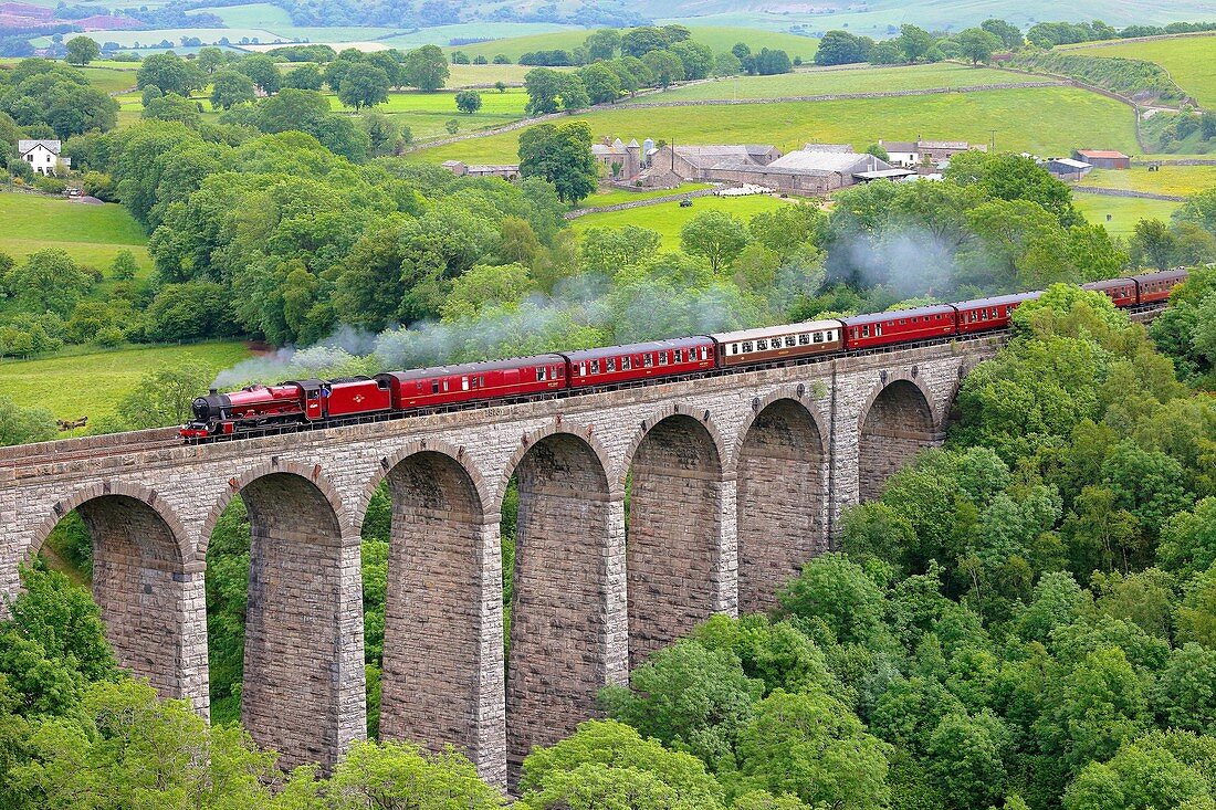 Steam train crossing Smardale Viaduct. Settle to Carlisle Railway Line, Eden Valley, Cumbria, England, UK.