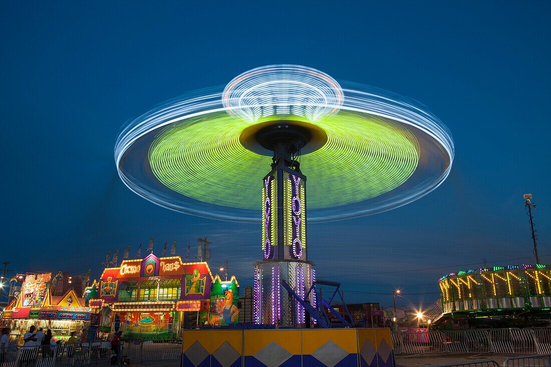 NASHVILLE - September 5: The colorfully illuminated Yo Yo spins on the midway at the Tennessee State Fair on September 5, 2014 at the Tennessee Fairgrounds in Nashville, Tennessee.