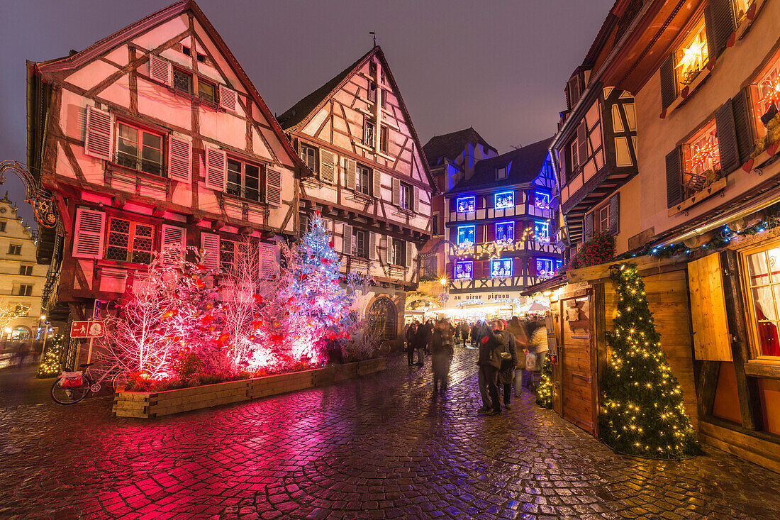 Typical houses enriched by Christmas ornaments and lights at dusk, Colmar, Haut-Rhin department, Alsace, France, Europe