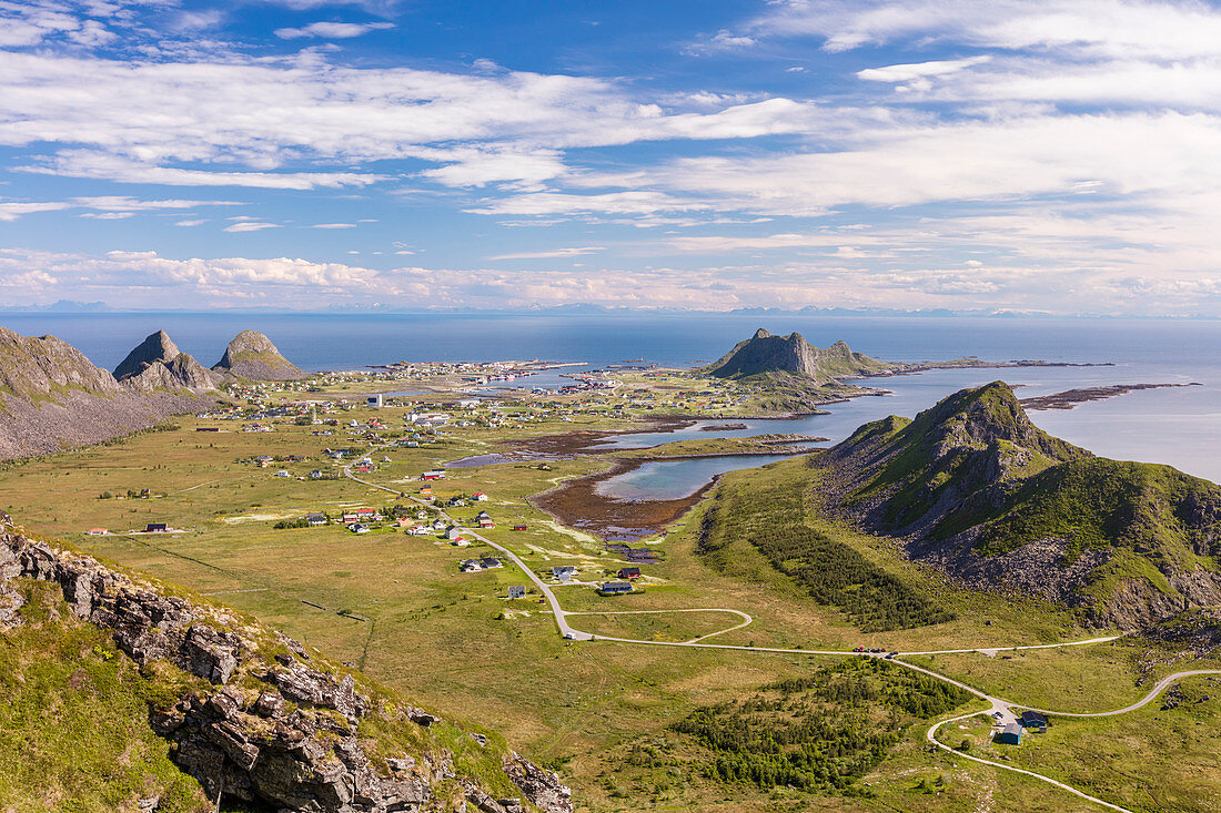 View of village of Sorland framed by green meadows and sea, Vaeroy Island, Nordland county, Lofoten archipelago, Norway, Scandinavia, Europe