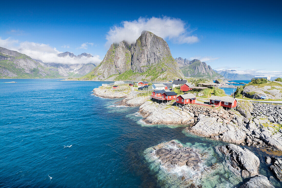 Top view of the fishing village framed by blue sea and high peaks Hamnoy, Moskenesoya, Nordland county, Lofoten Islands, Norway, Scandinavia, Europe