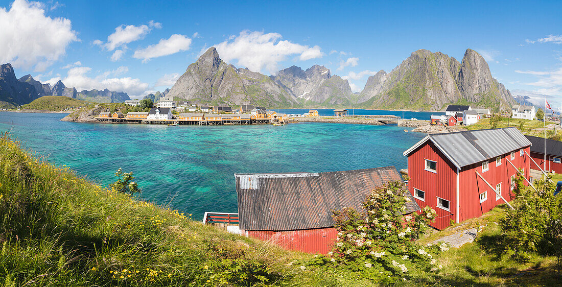 Panorama of turquoise sea and typical fishing village surrounded by rocky peaks, Sakrisoy, Reine, Moskenesoya, Lofoten Islands, Norway, Scandinavia, Europe