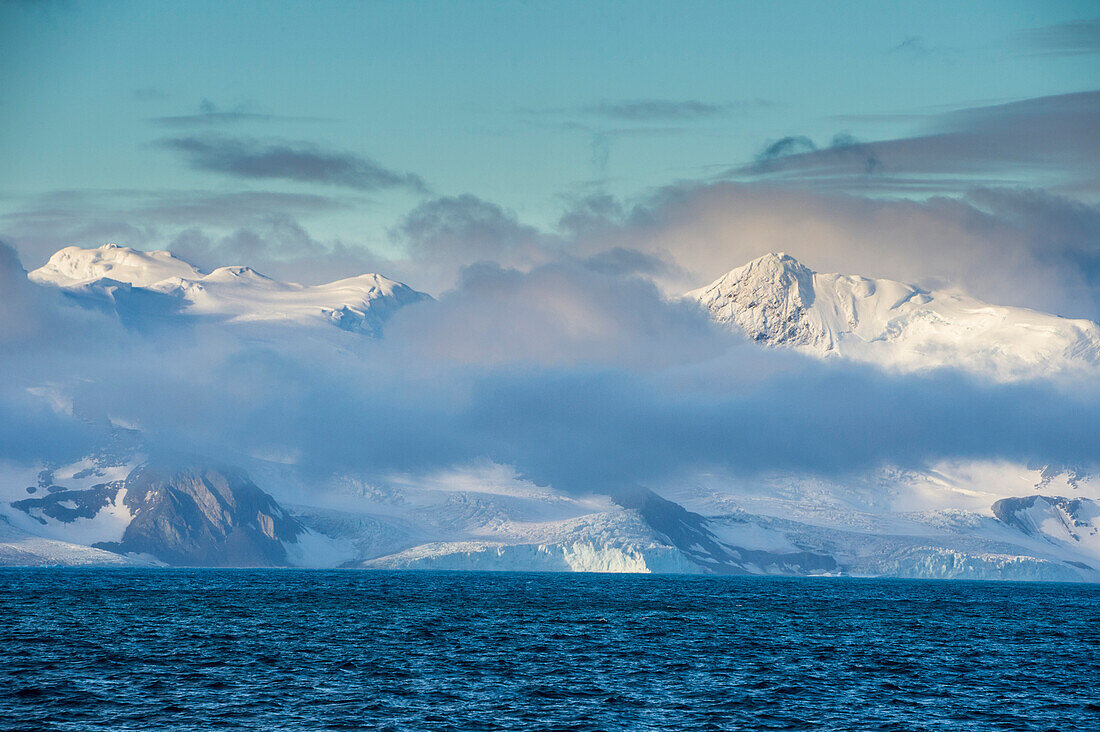 Mountain breaking through the clouds, Elephant Island, South Shetland Islands, Antarctica, Polar Regions