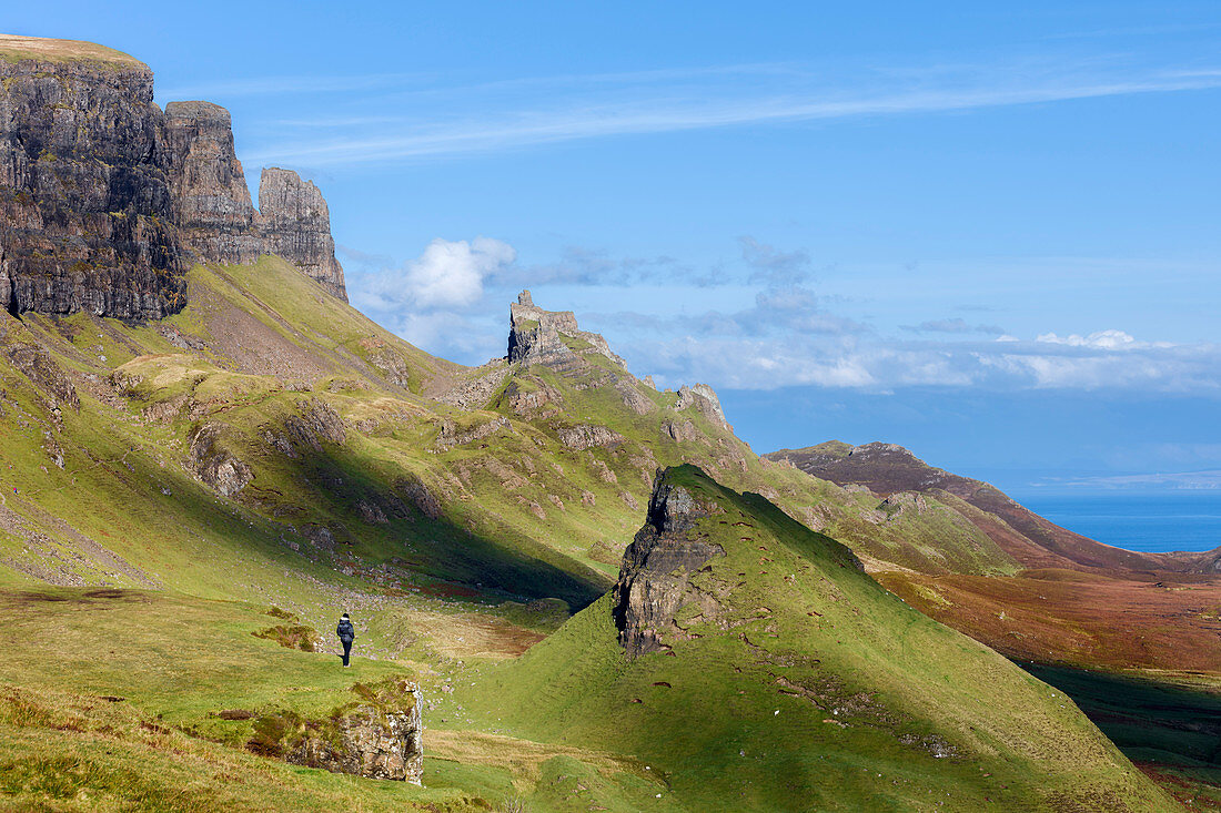 Looking out over the Quirang on the Trotternish ridge and beyond to the Isle of Harris in the Scottish Highlands, Isle of Skye, Inner Hebrides, Scotland, United Kingdom, Europe