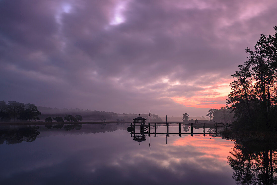 Sunrise and dock on intracoastal waterway, Calabash, North Carolina, United States of America, North America