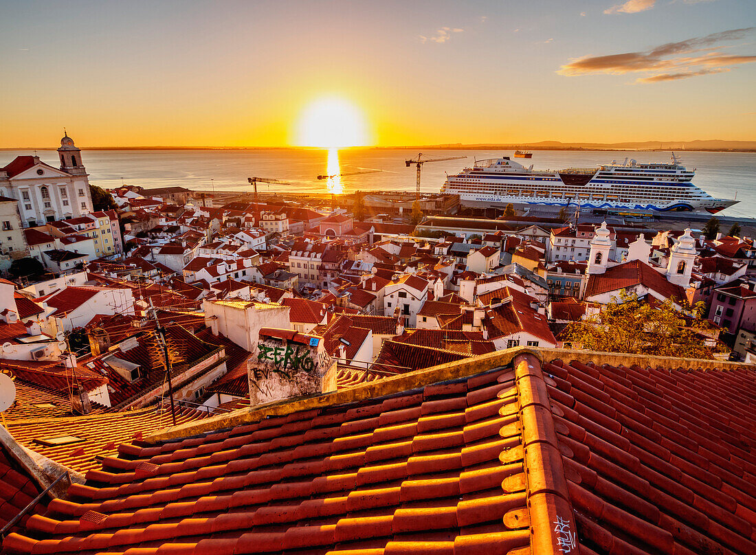 Miradouro das Portas do Sol, view over Alfama Neighbourhood towards the Tagus River at sunrise, Lisbon, Portugal, Europe