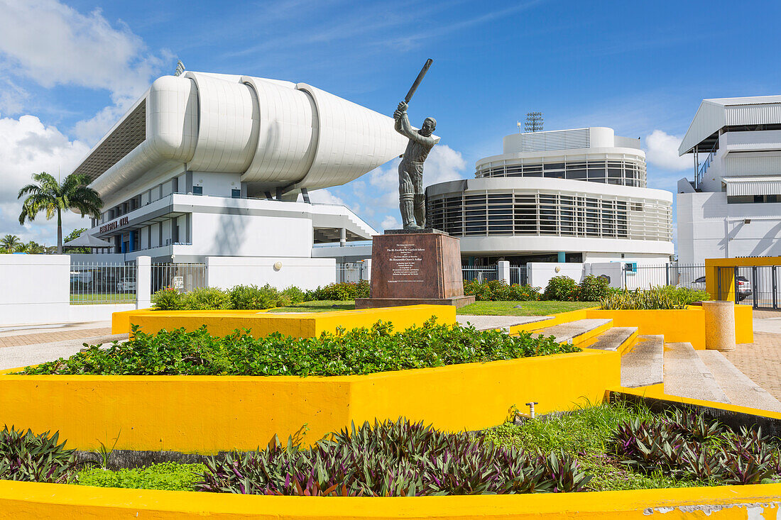 Garfield Sobers statue and The Kensington Oval Cricket Ground, Bridgetown, St. Michael, Barbados, West Indies, Caribbean, Central America