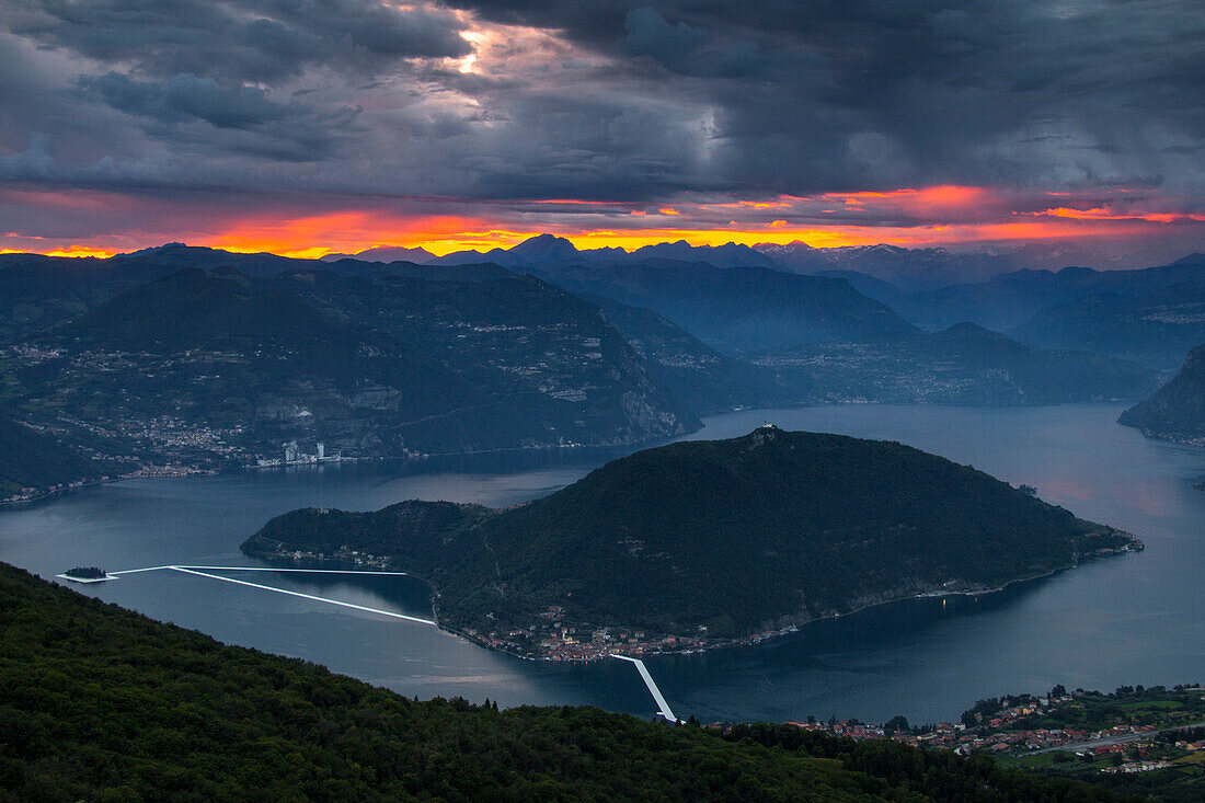 The Floating Piers in Iseo Lake at dusk , Italy, Europe