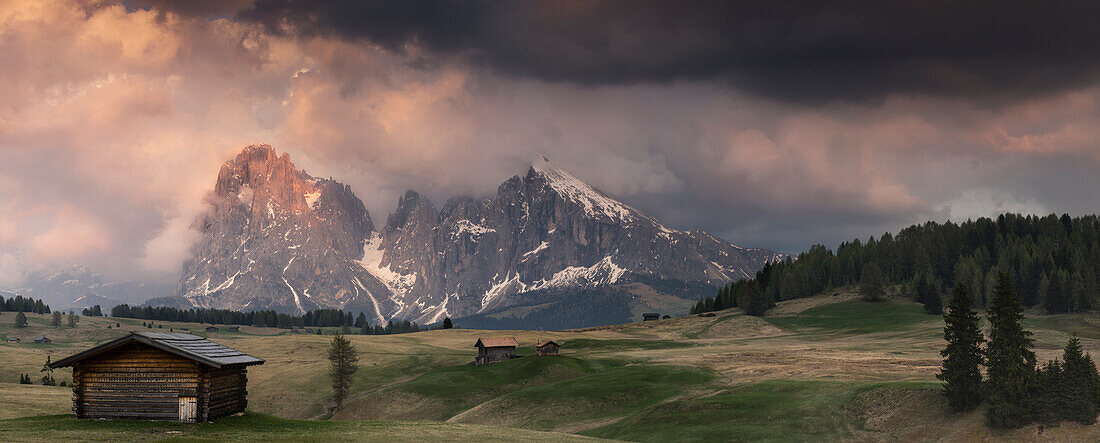 Alpe di Siusi/Seiser Alm, Dolomites, South Tyrol, Italy, Panoramic view of the Sassolungo/Langkofel and the Sassopiatto/Plattkofel during a beatiful sunset