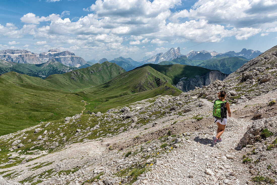 Italy, Trentino Alto Adige, Val di Fassa, Hiker on his way to the Dona Val from the Antermoia refuge