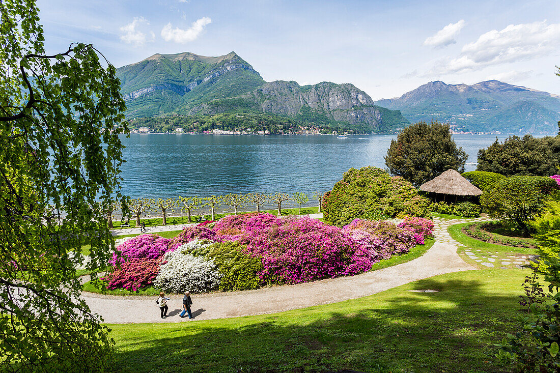 A couple of tourists visit the gardens of Villa Melzi d'Eril in Bellagio, Lake Como, Lombardy, Italy