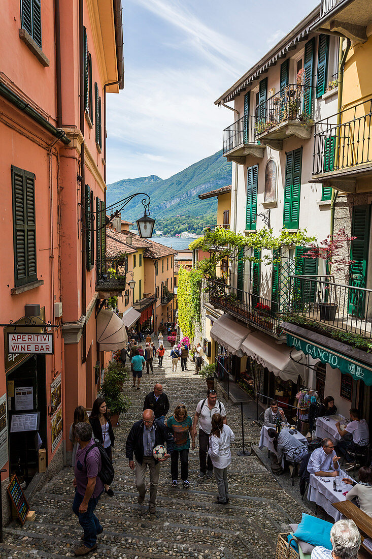 Tourists walking through the alleys in the town of Bellagio, Lake Como, Lombardy, Italy