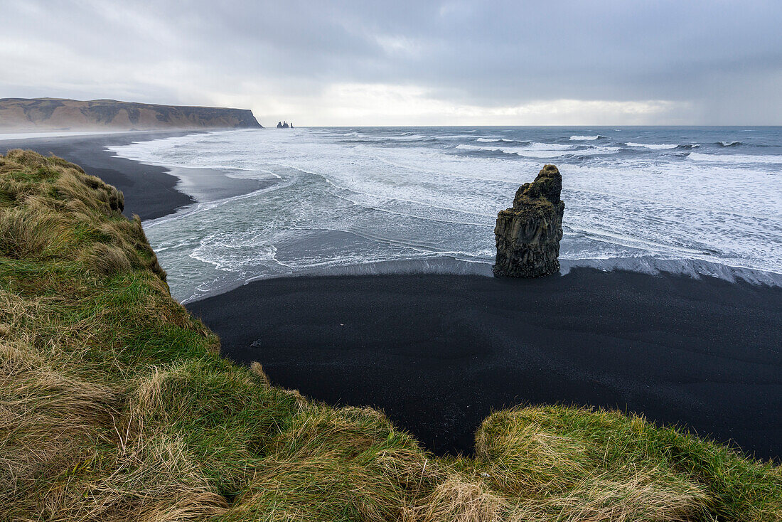 Solitary rock at the beach of Reynisfjara, Vik, Sudurland, Iceland, Europe