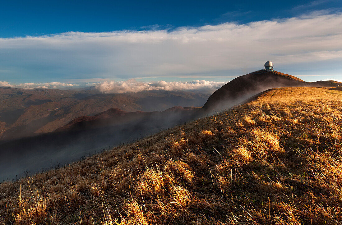 Ligurian Apennines, Piedmont, Italy, Monte Lesima at sunset with the radar used for air traffic control