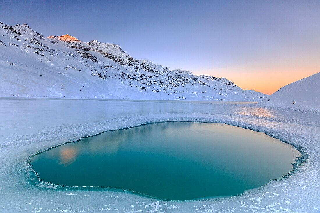 Puddle in the middle of Lake Bianco the only point where the water rises to the surface, Bernina Pass, Canton of Graubunden, Engadine, Switzerland, Europe