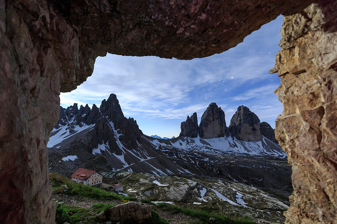 The Three Peaks of Lavaredo seen from a cave at night, Sesto Dolomites Trentino Alto Adige Italy Europe