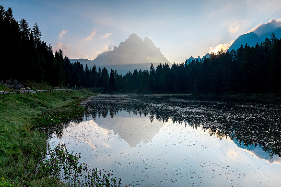 The Three Peaks of Lavaredo are reflected in Lake Antorno at sunrise, Veneto Sesto Dolomites Italy Europe