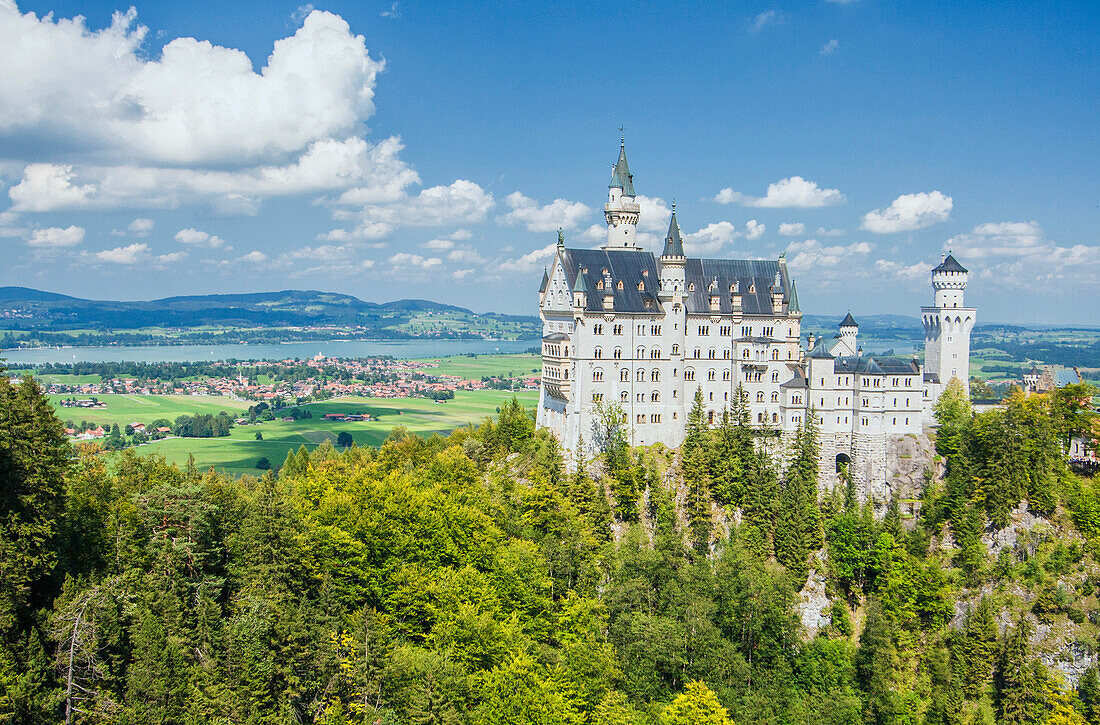 Neuschwanstein castle surrounded by woods Fussen Bavaria southern Germany Europe