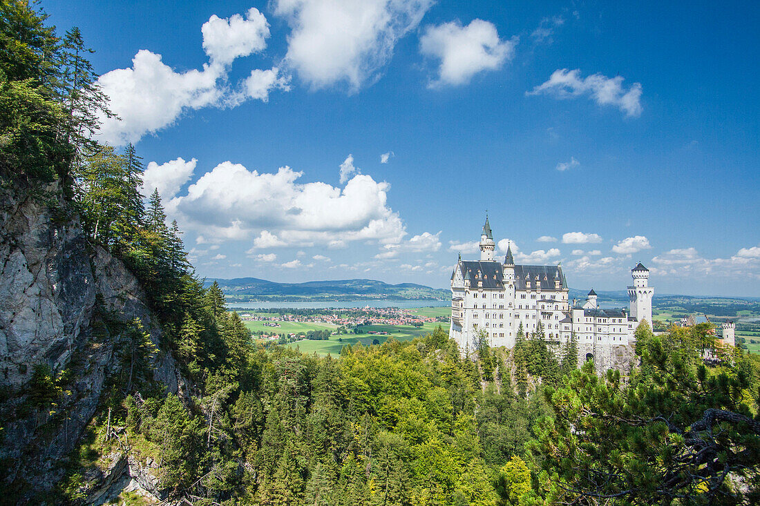 Neuschwanstein castle surrounded by woods Fussen Bavaria southern Germany Europe