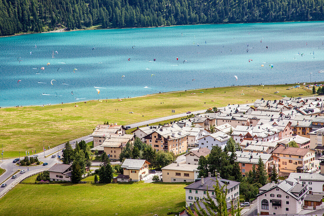 The turquoise water of Lake Silvaplana surrounded by green meadows Engadine Canton of Grisons Switzerland Europe