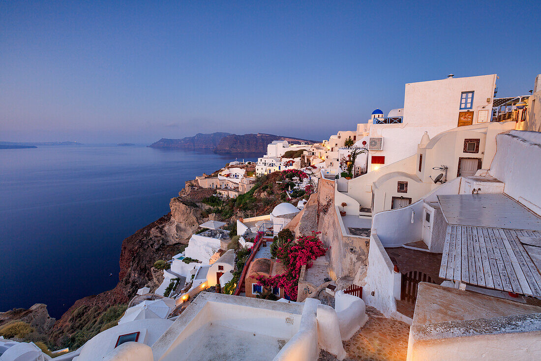View of the Aegean Sea from the typical greek village of Oia at dusk Santorini Cyclades Greece Europe
