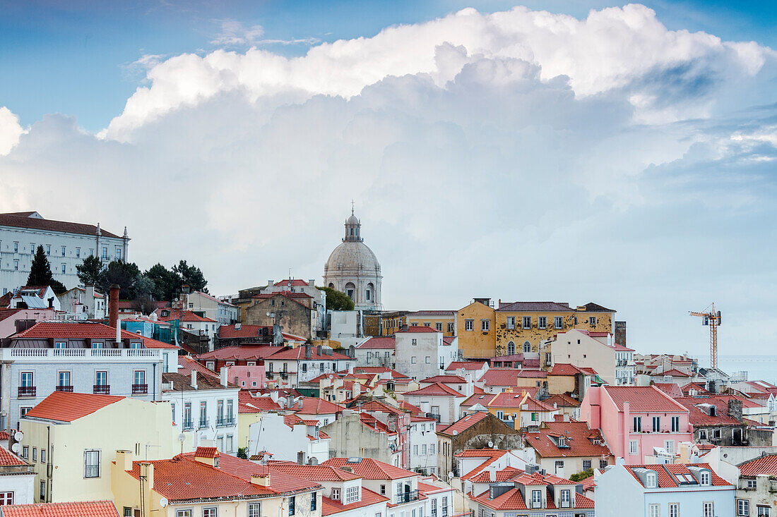 Terracotta roofs and the ancient dome seen from Miradouro Alfama one of the many viewpoints of Lisbon Portugal Europe