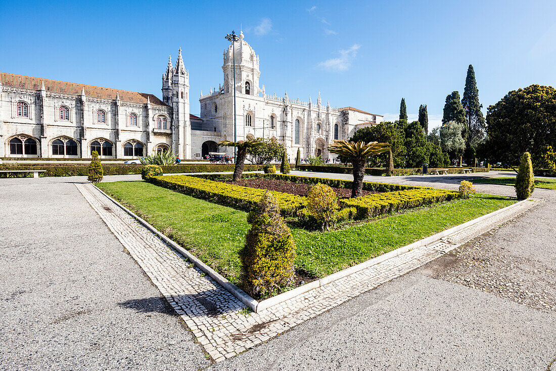 Jeronimos Monastery with late Gothic architecture surrounded by gardens Santa Maria de Belem Lisbon Portugal Europe