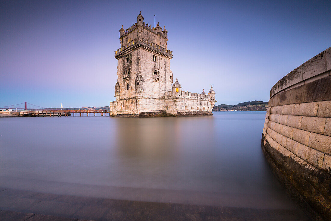 The colorful dusk on the Tower of Bel+®m reflected in Tagus River Padr+úo dos Descobrimentos Lisbon Portugal Europe