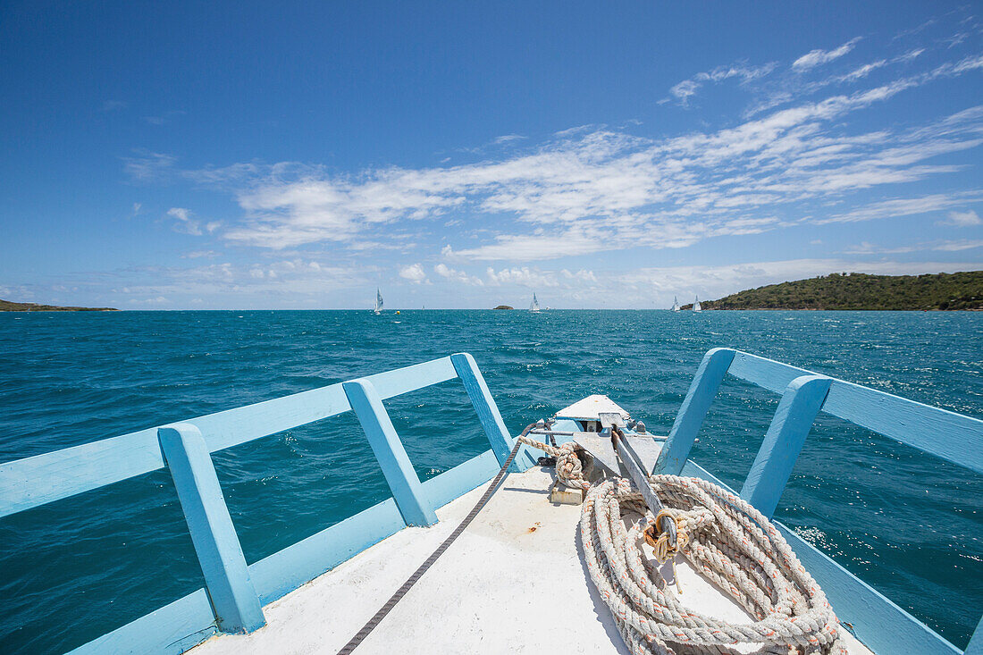 Boats sailing in the turquoise waters of the Caribbean Sea Green Island Antigua and Barbuda Leeward Island West Indies