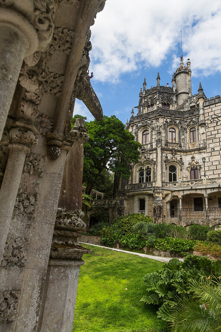 Old mystical buildings of Romanesque Gothic and Renaissance style inside the park Quinta da Regaleira Sintra Portugal Europe