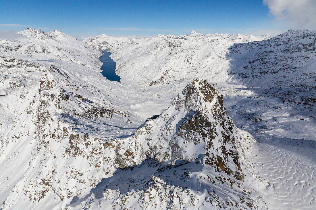 Aerial view of snowy Peak Peloso surrounded by Lago di Lei Val di Lei Chiavenna Spluga Valley Valtellina Lombardy Italy Europe