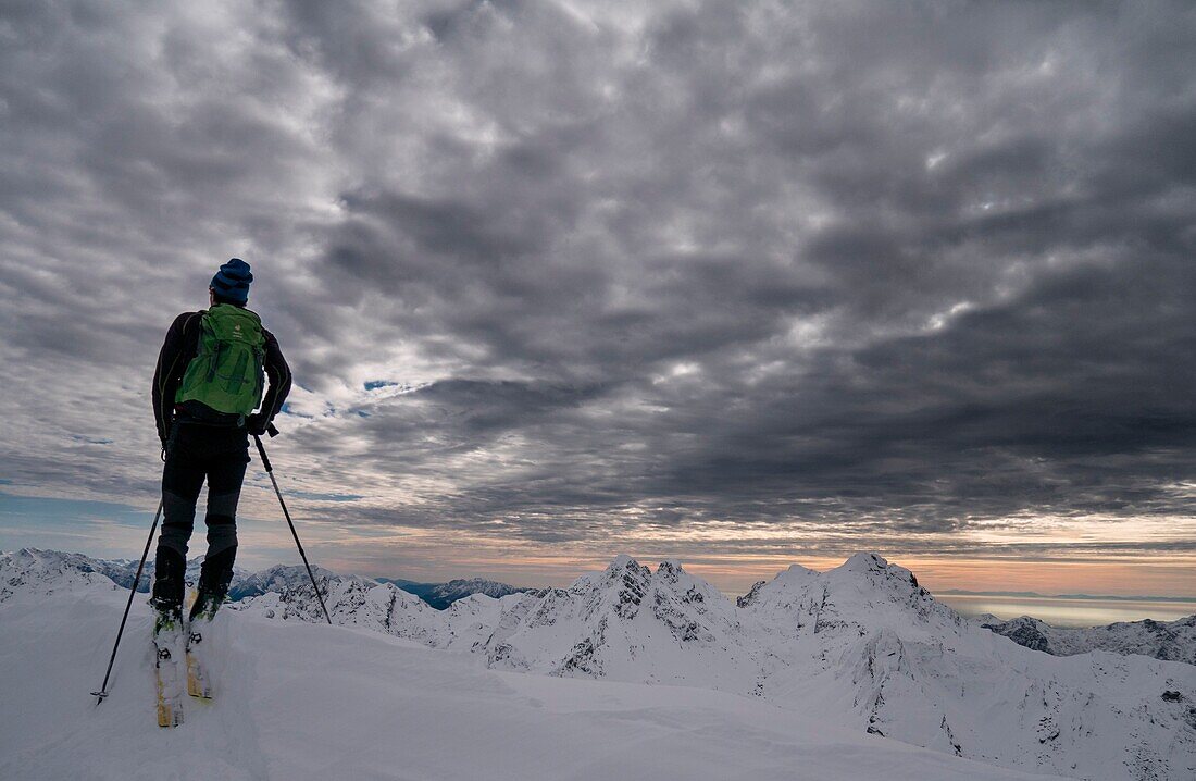 A skier in an arctic, like light, Pizzo Tre Signori group, Valgerola, Valtellina, Lombardy, Italy