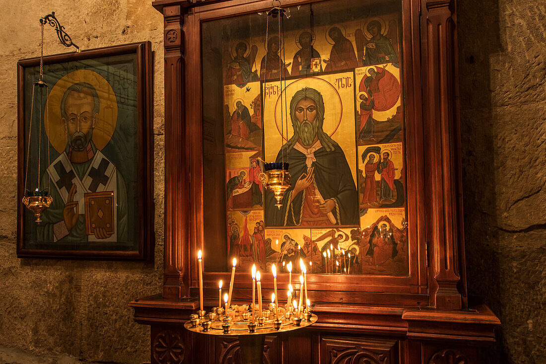 'Lit candles by a Christian Orthodox icon in the interior of Svetitskhoveli Cathedral; Mtskheta, Mtskheta-Mtianeti, Georgia'