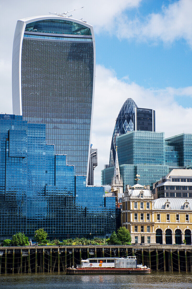 'Looking across the River Thames to the City of London (The Walkie Talkie building and The Gherkin, centre); London, England'