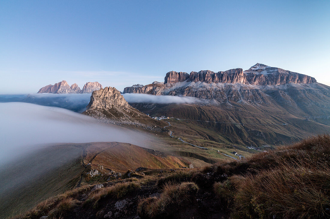 Piz Boa Sassolungo and Sass Beca shrouded in morning fog Cima Belvedere, Canazei, Val di Fassa, Trentino-Alto Adige, Italy, Europe