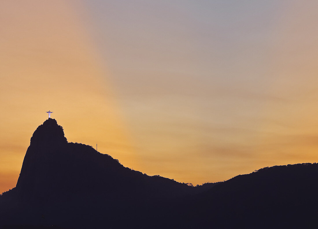 Sunset view of Christ the Redeemer statue and Corcovado Mountain, Rio de Janeiro, Brazil, South America