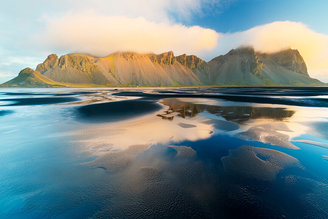 Mount Vestrahorn shrouded in clouds at sunrise, Stokksnes, Iceland, Polar Regions