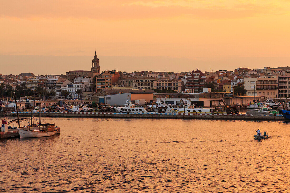 Fishing boats and town at sunrise, Palamos, Costa Brava, Girona, Catalonia, Spain, Europe