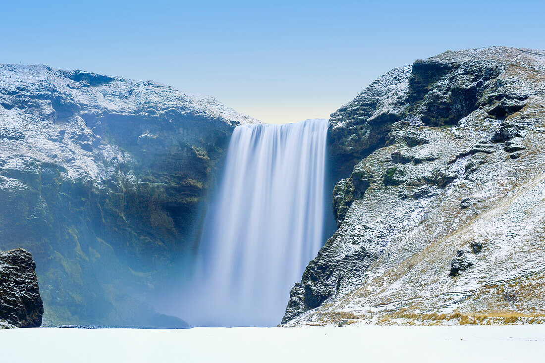 Skogafoss Waterfall in snow, Iceland, Polar Regions