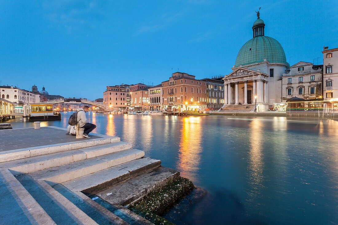 Night falls on Grand Canal in Venice, Italy. San Simeone Piccolo church in the background.